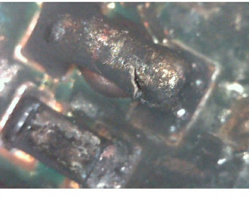 Image of a resistor that has overheated.